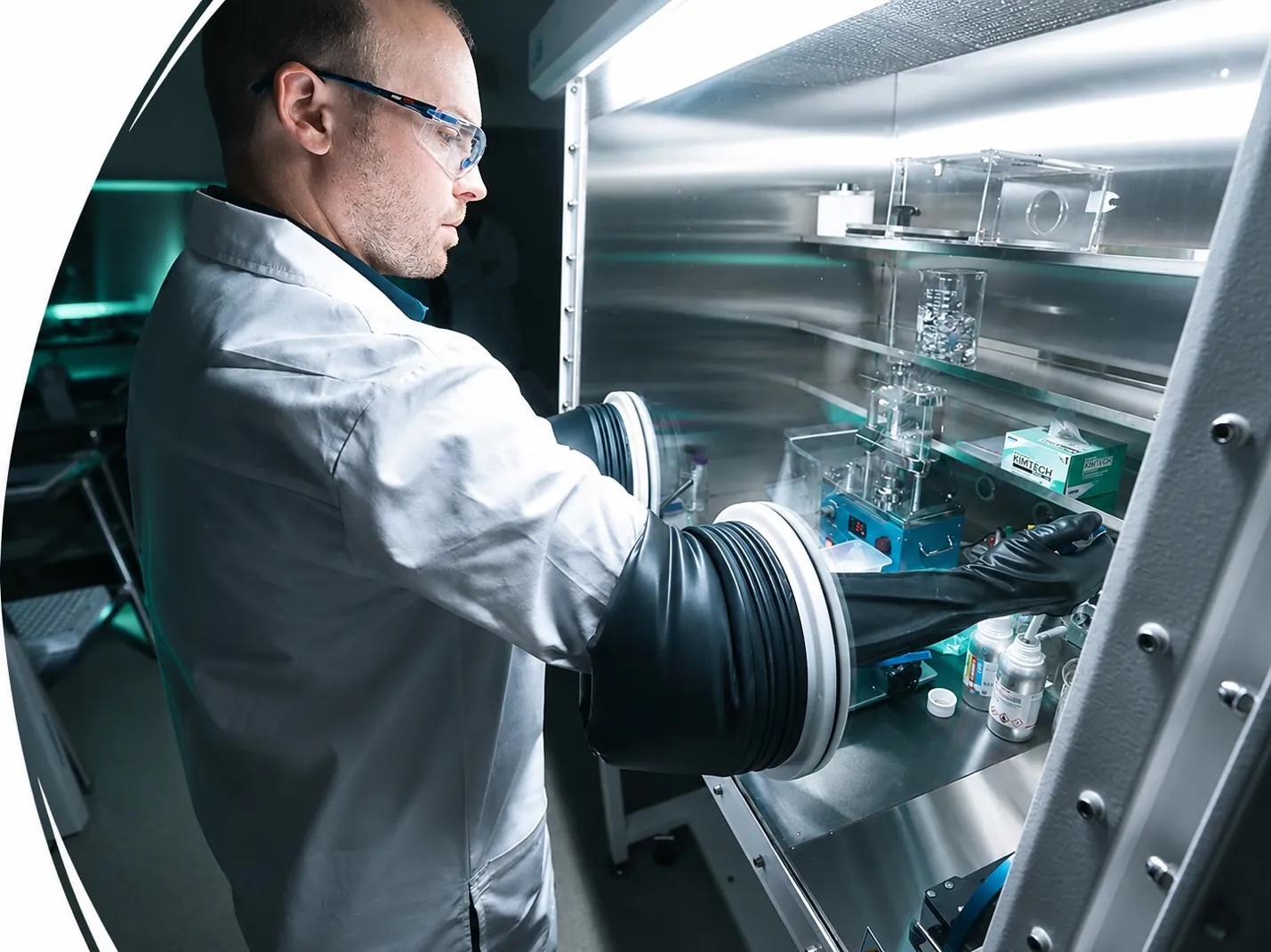 Scientist working inside an argon glovebox